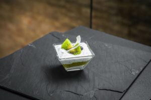 Chia pudding with kiwi and blueberries in a glass