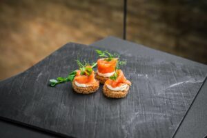 Cream cheese and salmon on dark toast