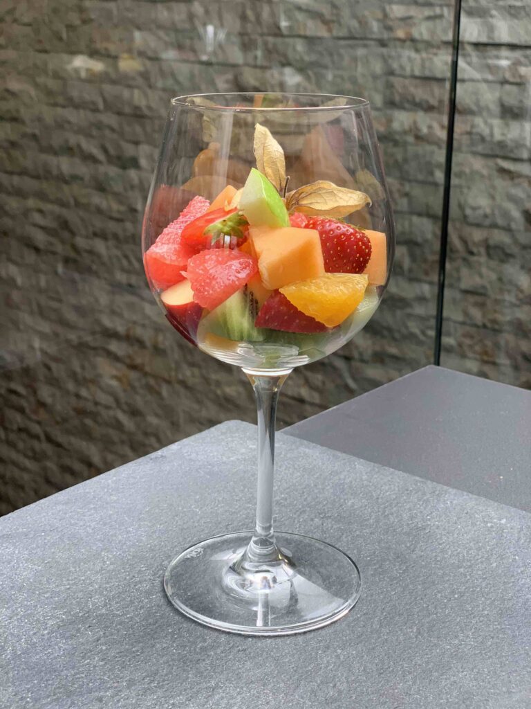 Sliced fresh fruit in a glass