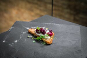 Roasted grapes with ricotta on grilled bread