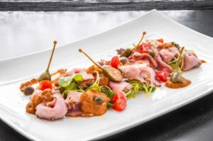 Thin slices of roast milk-fed veal