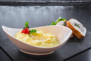 Smoked mashed potatoes with butter and parsley